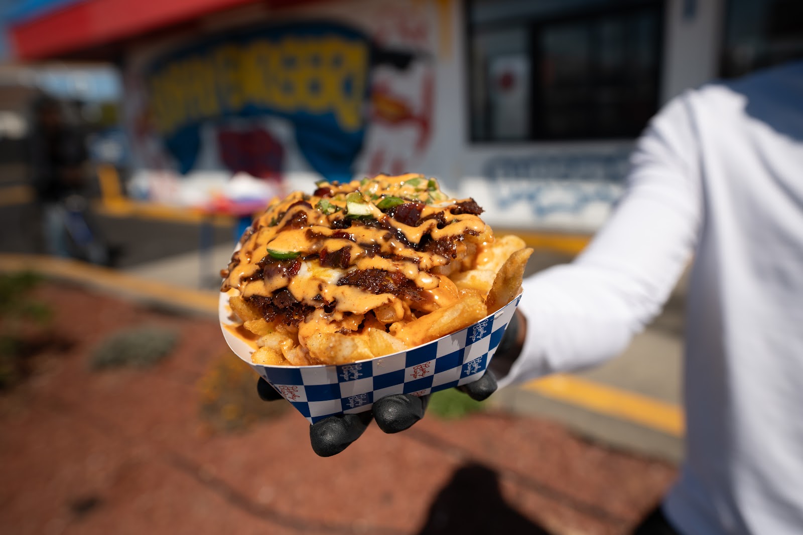 Loaded Fries — fresh cut fries topped with You Feel Me sauce, chopped burger patty, jalapeños and onions